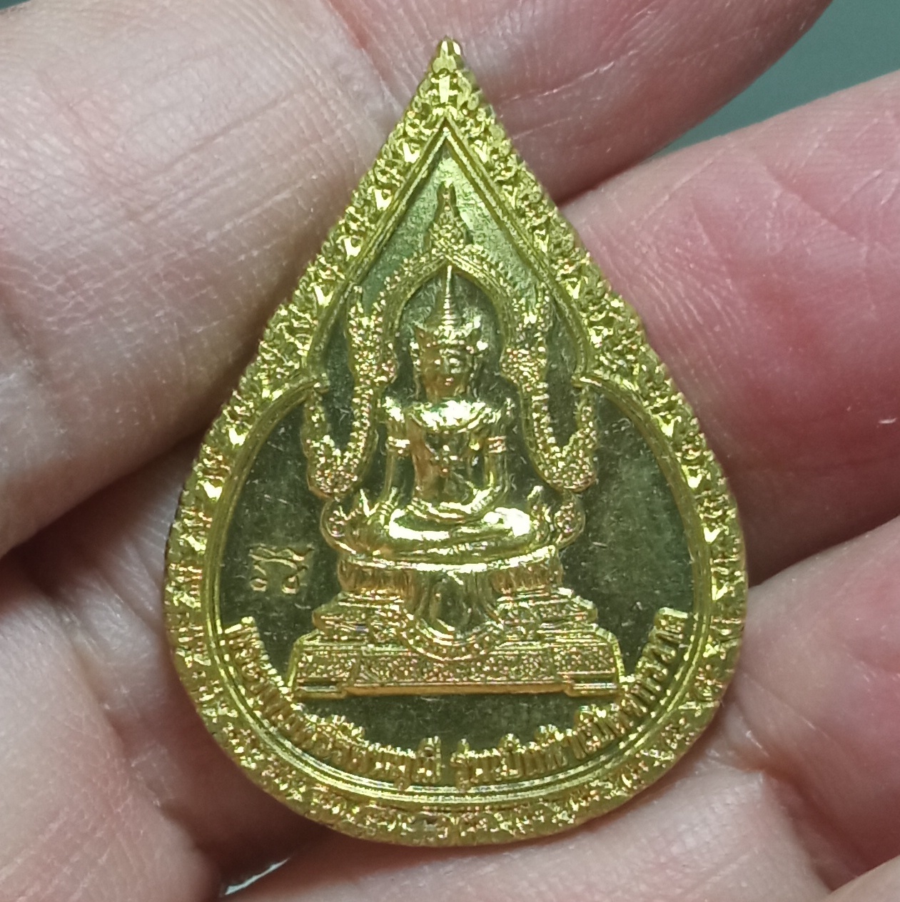 เหรียญพระพุทธศรีรัตนมุนี เนื้อทองฝาบาตร รุ่นเบิกฟ้าเปิดจักรวาล หลังหลวงปู่เทพโลกอุดร สำนักสงฆ์ถ้ำมุนี ตำบลช่องแค อำเภอตาคลี จังหวัดนครสวรรค์ ปี2557 ตอกโค๊ต
