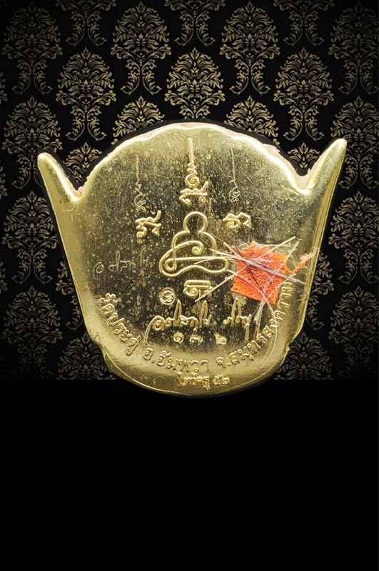ล็อกเก็ตเศียรพระพิราพ รุ่นแรก งานไหว้ครู ปี 52(ปีแรก) สร้าง300ชิ้น องค์นี้พิเศษ ติดจีวร เกศา จาร พร้อมลายเซ็นต์ หลวงพ่อมหาสุรศักดิ์ หมายเลข ๑๗๒