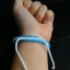 สร้อยข้อมือยาว 9" ด้ายมงคล+ตะกรุด ยาว วัดสุทัศน์ฯ ปี 2556 ใส่ซองวัด พร้อมคาถาบูชา