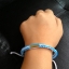 สร้อยข้อมือยาว 9" ด้ายมงคล+ตะกรุด ยาว วัดสุทัศน์ฯ ปี 2556 ใส่ซองวัด พร้อมคาถาบูชา